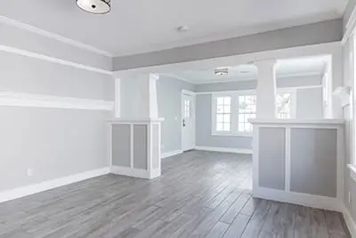 An interior residential room with beige walls, white ceiling